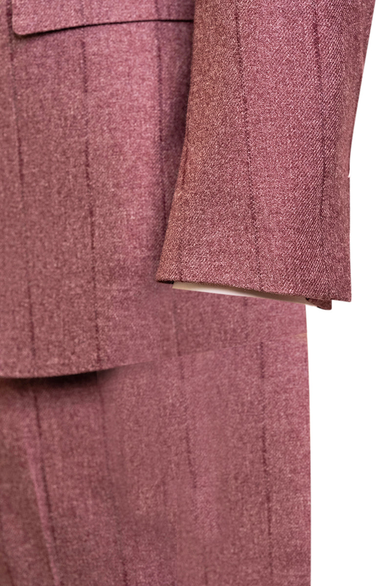 Close-up of a textured pinkish-brown fabric with a subtle pattern.