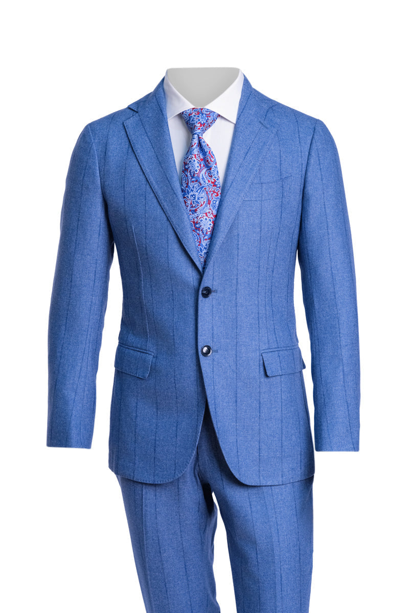 Blue suit with a patterned tie on a white background