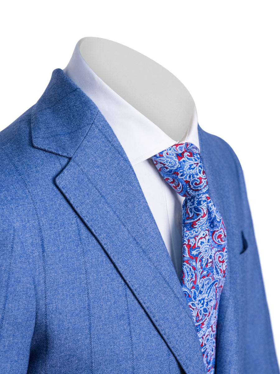 Blue suit jacket with a white shirt and patterned tie on a mannequin against a white background