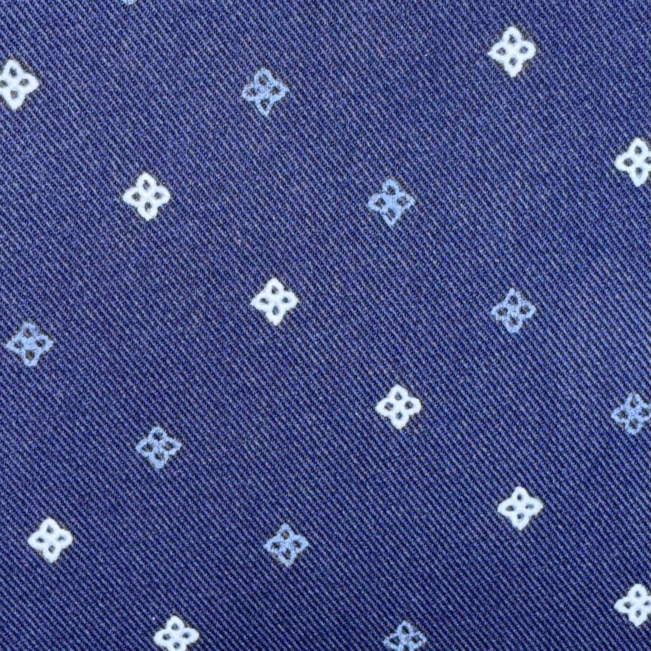 Navy blue fabric with small white floral patterns