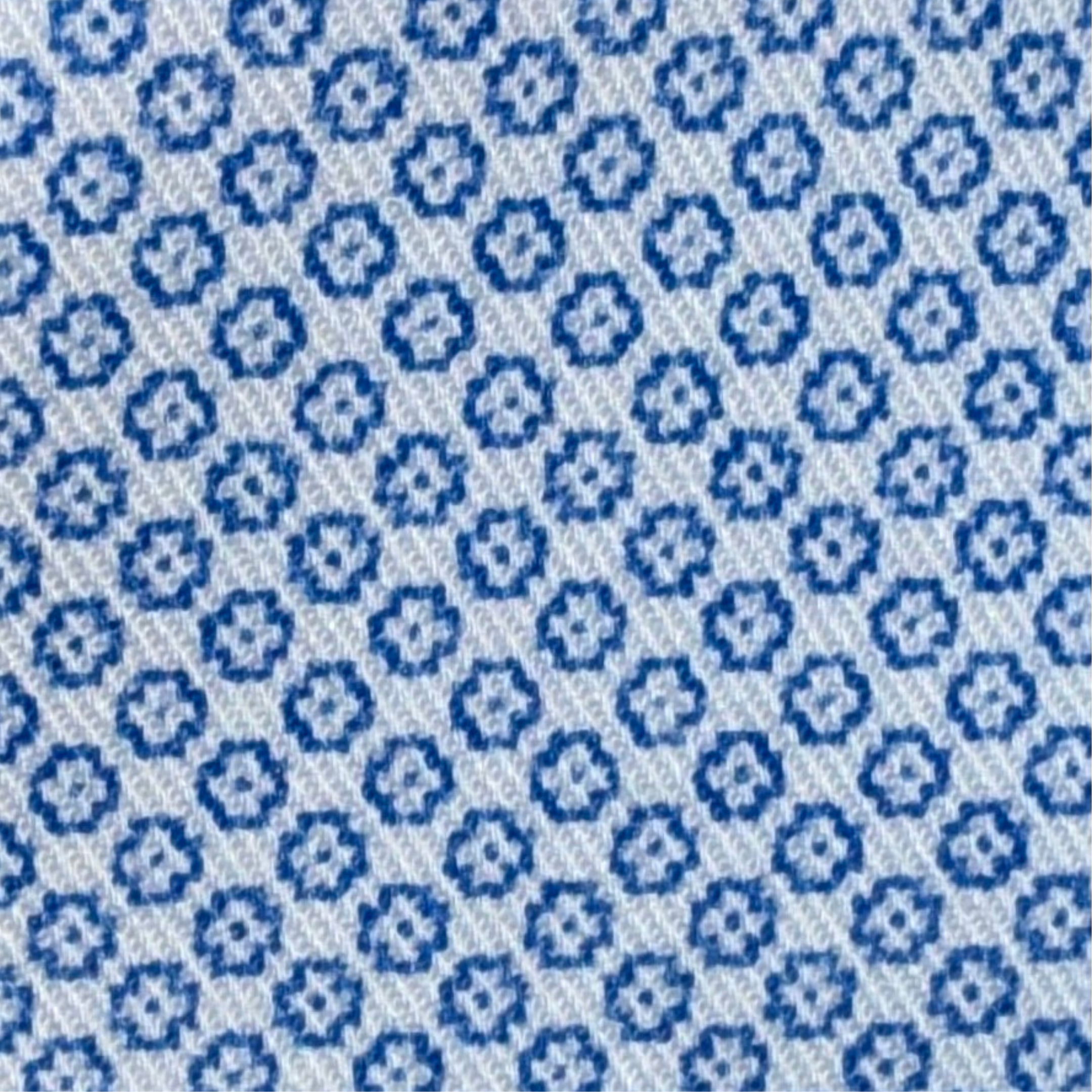 Pattern of blue flowers on a light blue background