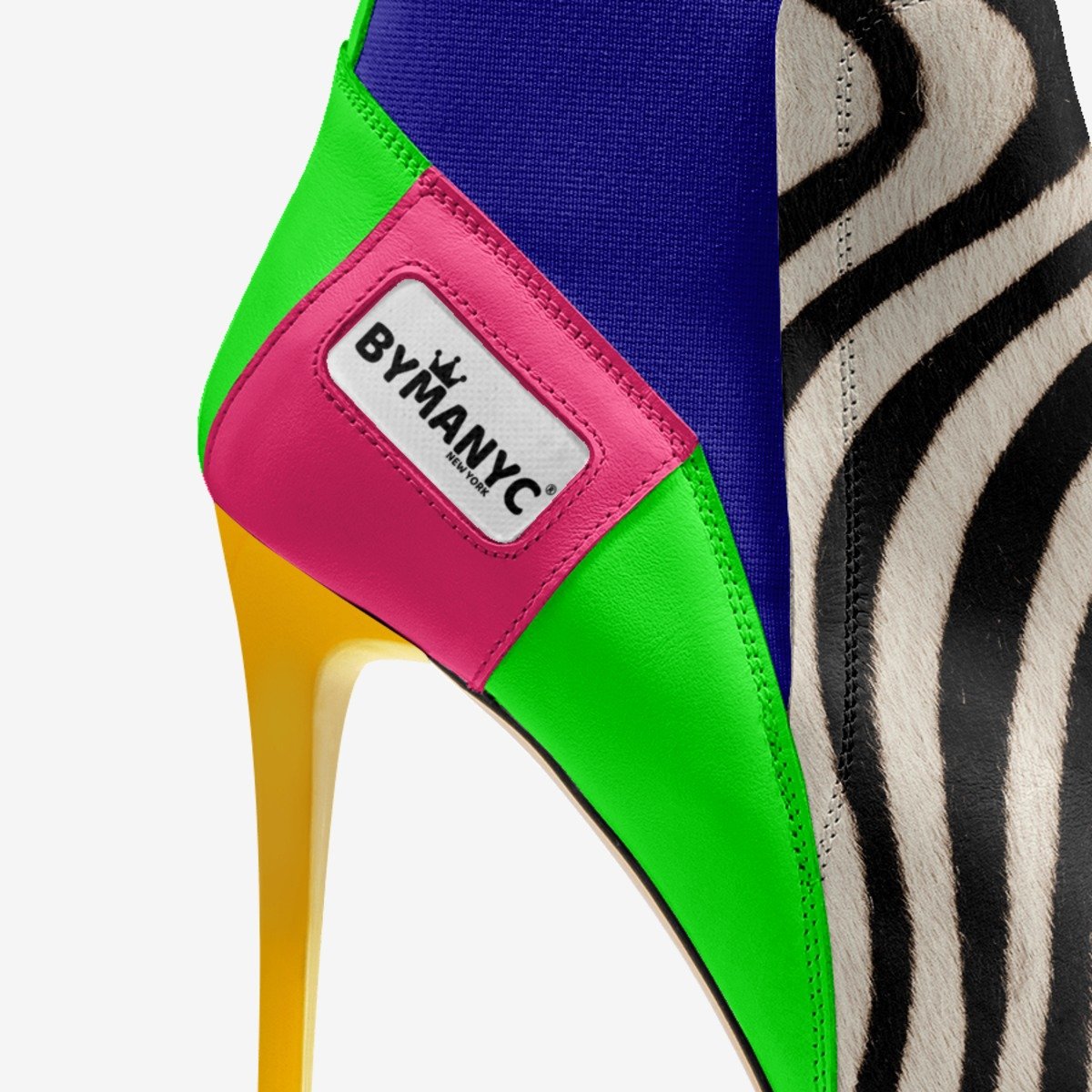 Colorful shoe with a zebra pattern and ByManyc label on a white background