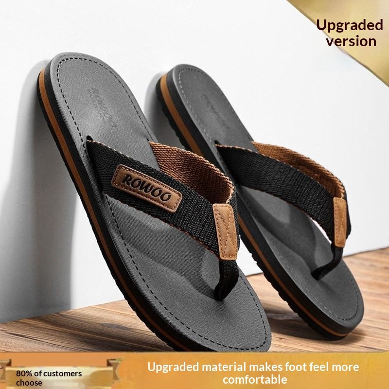 Pair of black sandals with brown accents on a wooden surface, featuring the brand 'ROWOO'.
