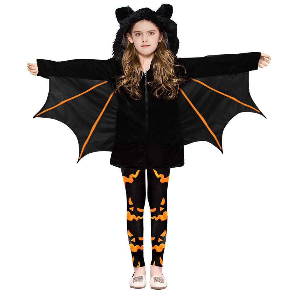Child wearing a black bat costume with orange accents on a white background