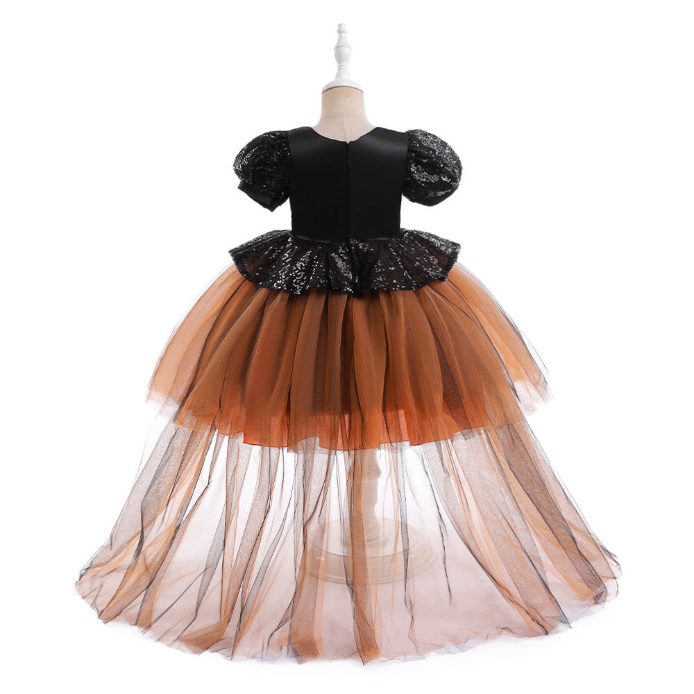 Black and orange dress with sequin top on a mannequin against a white background