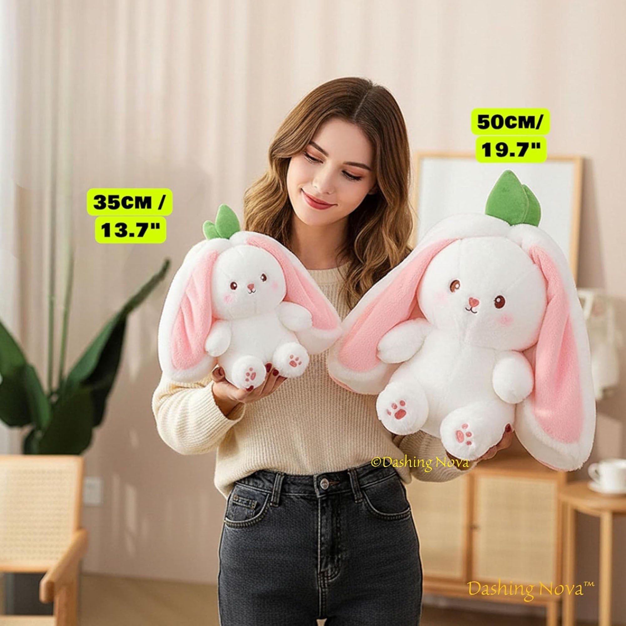 Woman holding two plush toys with bunny ears, labeled in centimeters, in a room setting.