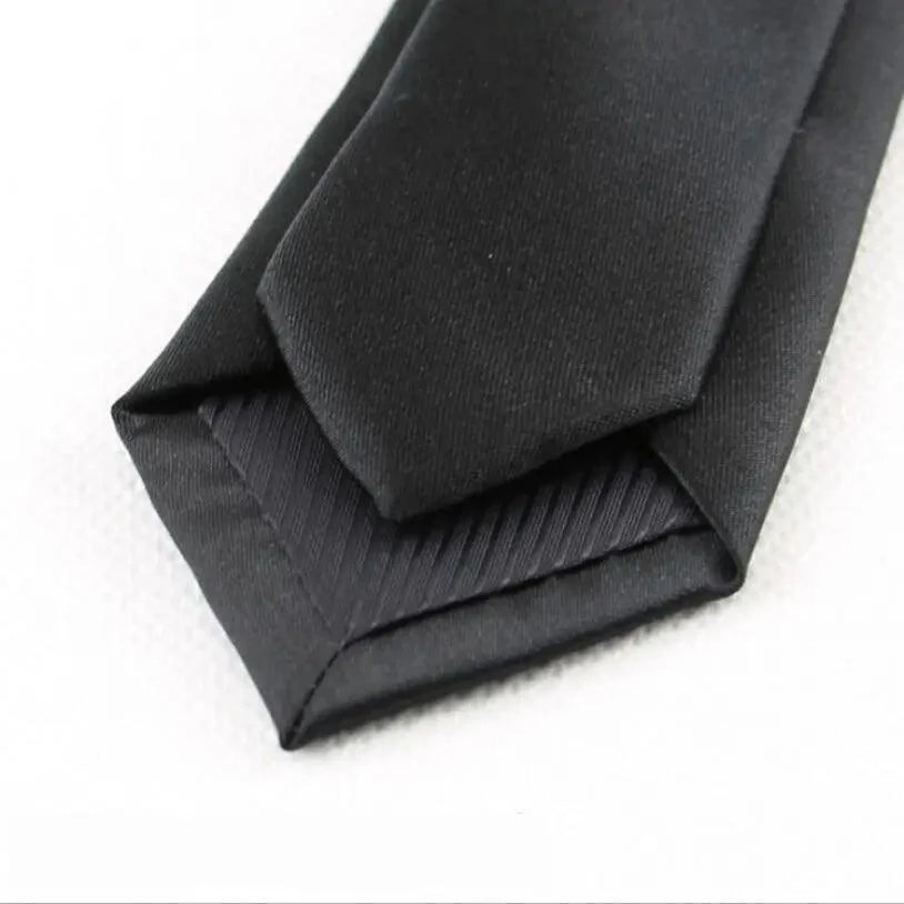Folded black fabric on a white background