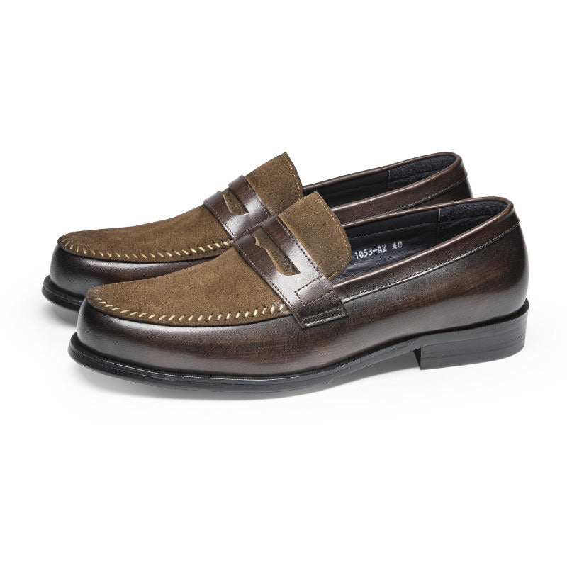 Pair of brown loafers on a white background