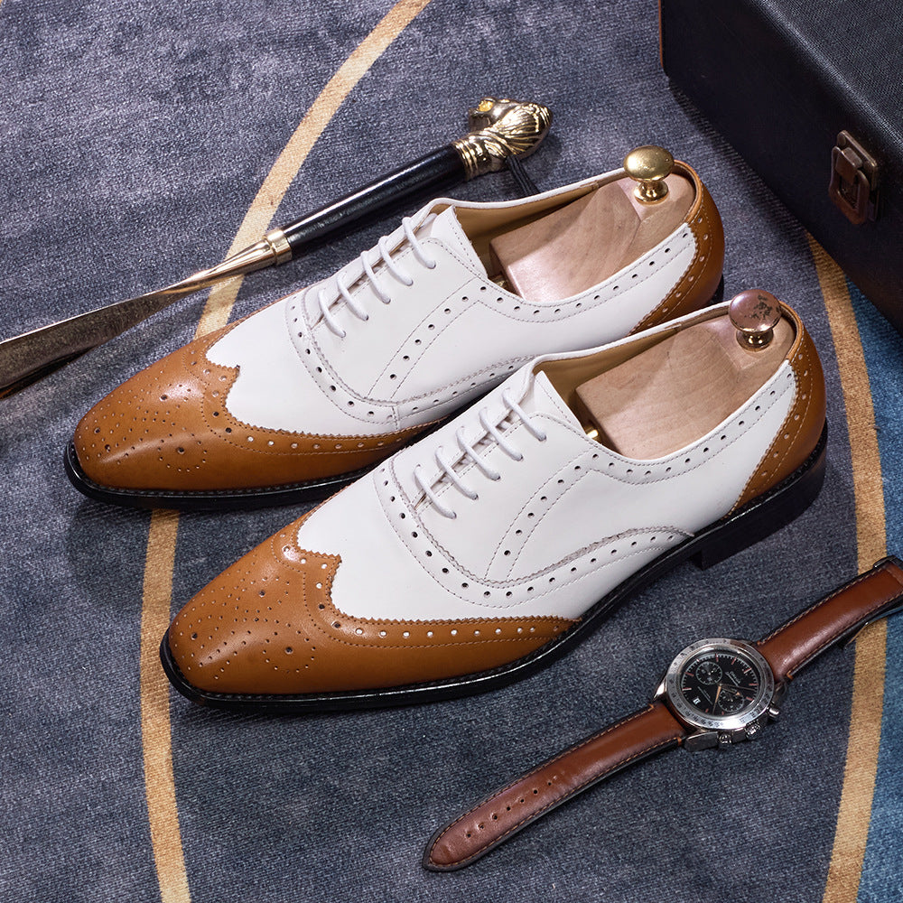 Brown and white shoes with a watch on a textured surface