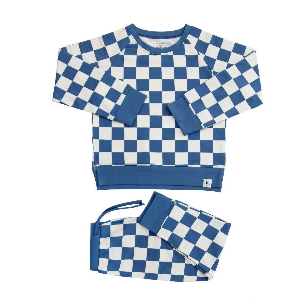 Blue and white checkered sweater and matching bag on a white background