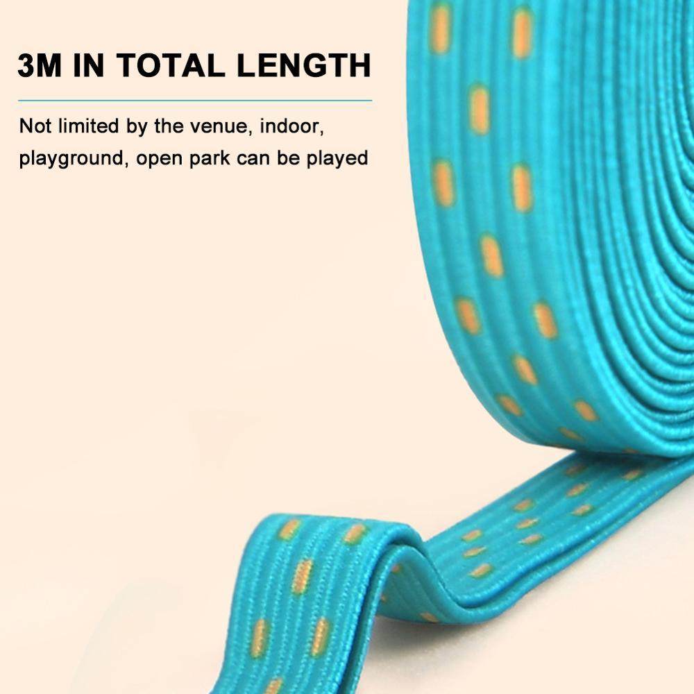 Turquoise resistance band with yellow dots on a beige background
