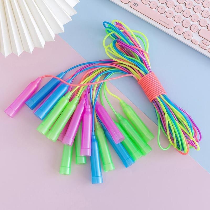 Colorful jump rope on a pastel background with a keyboard.