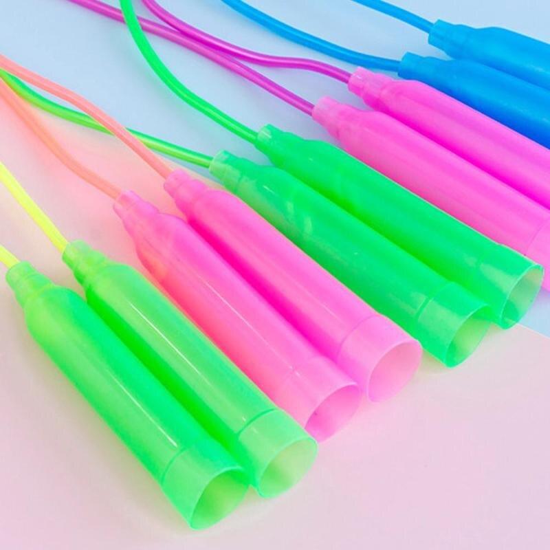 Colorful jump ropes on a light background