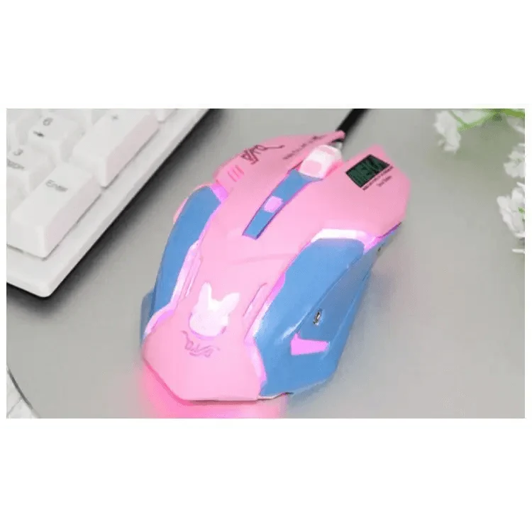 Pink and blue gaming mouse on a desk with a keyboard in the background