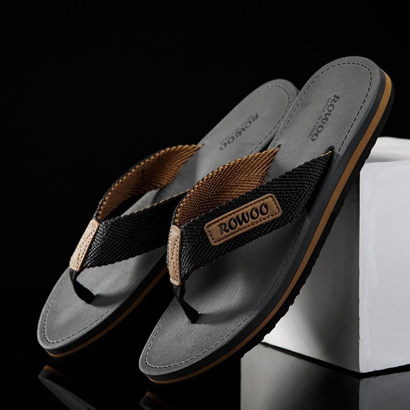 Pair of sandals with 'ROWOO' branding on a black background