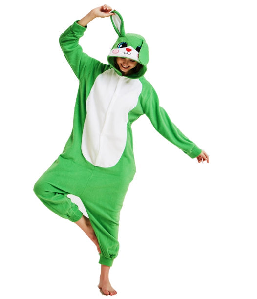 Person wearing a green and white animal onesie on a white background
