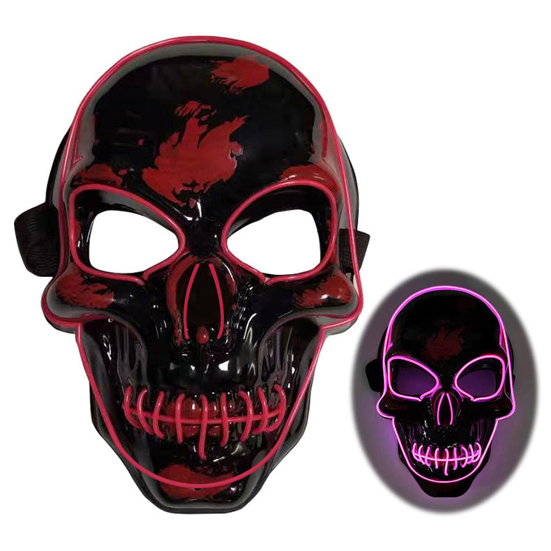 Black and red skull mask with LED lighting on a white background