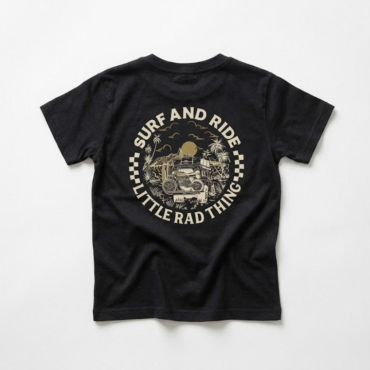 Black t-shirt with 'Surf and Ride Little Rad Thing' graphic on a white background
