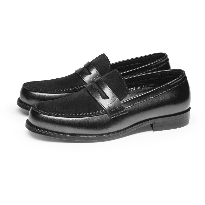 Pair of black loafers on a white background