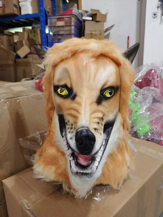Fox mask on a cardboard box in an indoor setting with boxes and shelves in the background