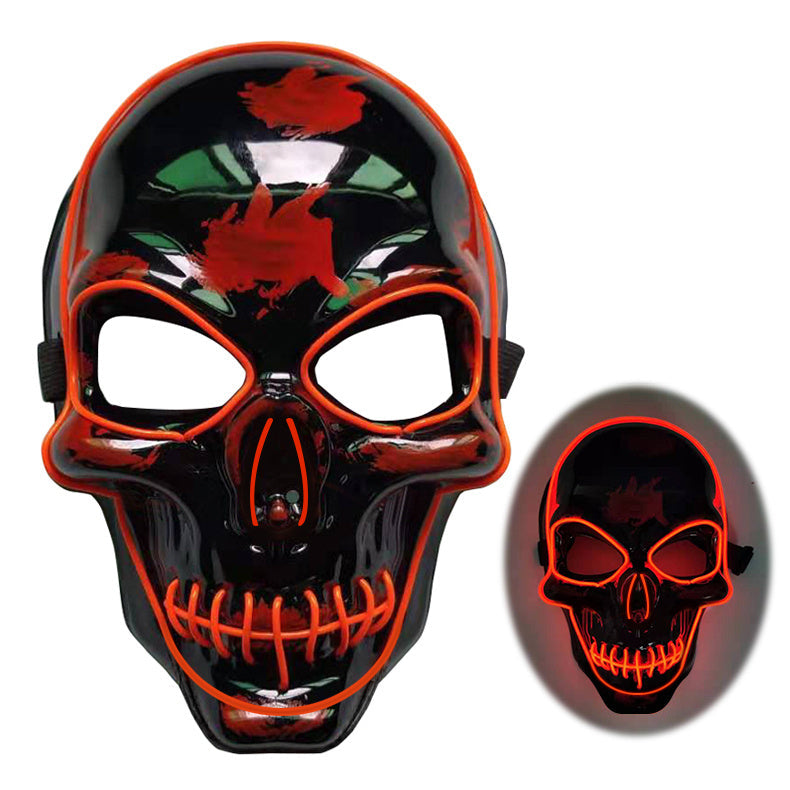 Black skull mask with red accents and glowing effect on a white background