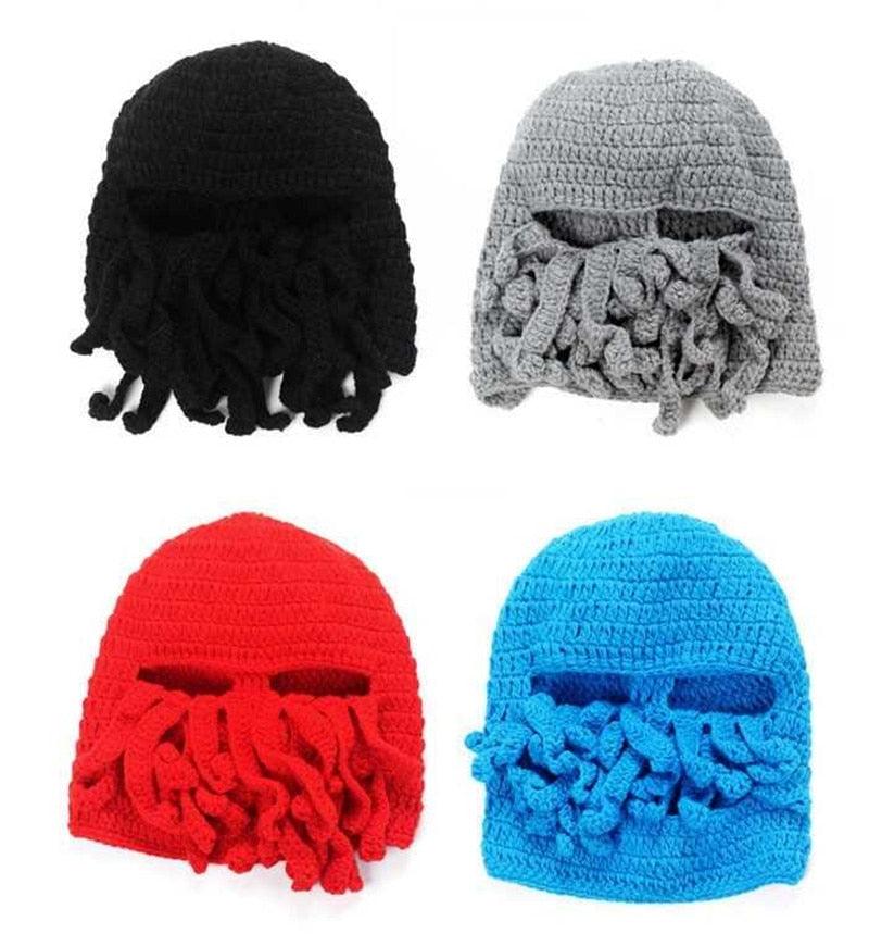 Four crochet hats in black, gray, red, and blue with face masks on a white background.