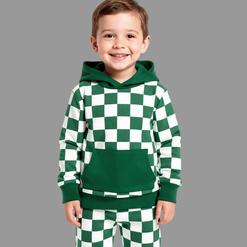Child wearing a green and white checkered hoodie and pants on a gray background