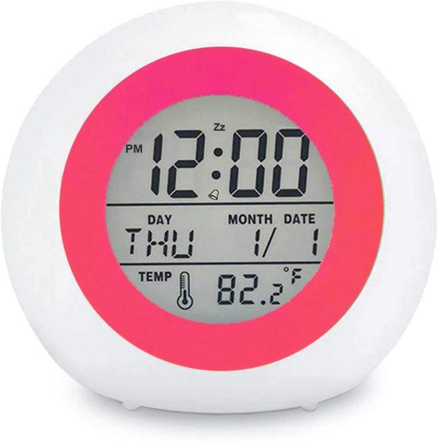 Digital clock with pink border on a white background