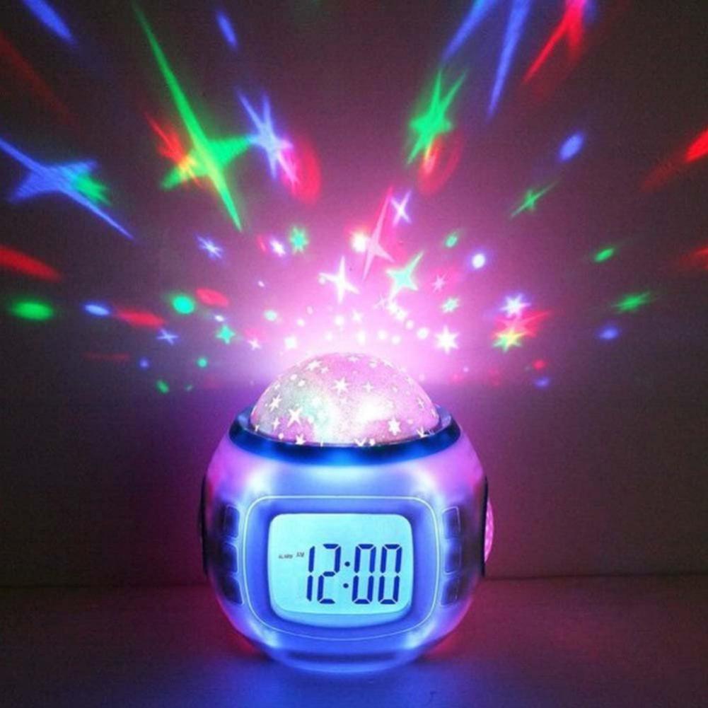 Colorful star projector with digital clock on a dark background
