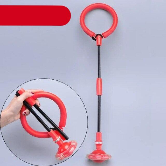 Red and black plunger on a gray background with a close-up inset showing a hand holding it.