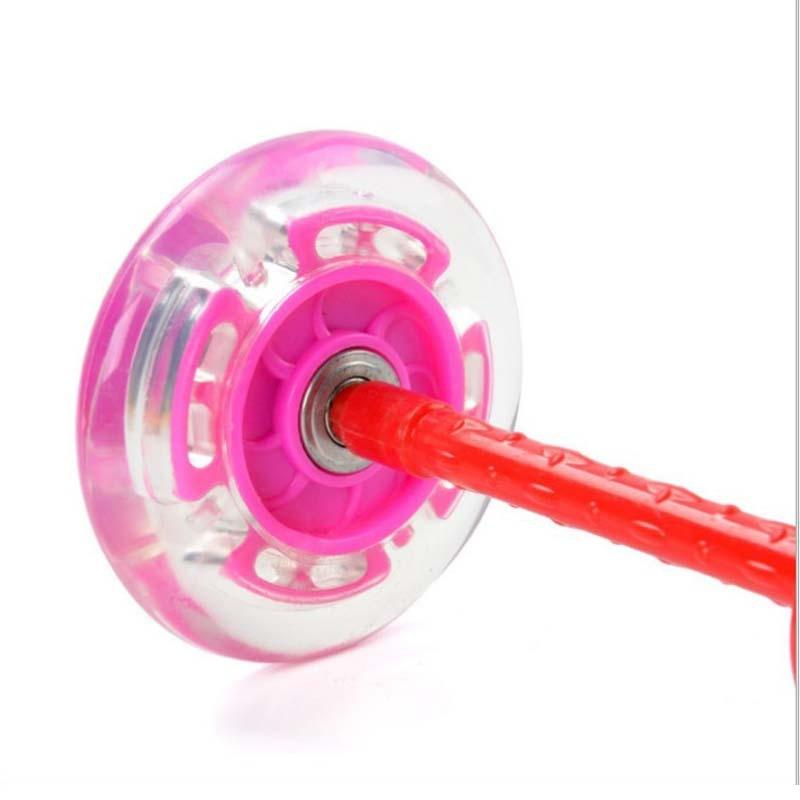 Pink and clear yo-yo with a red string on a white background