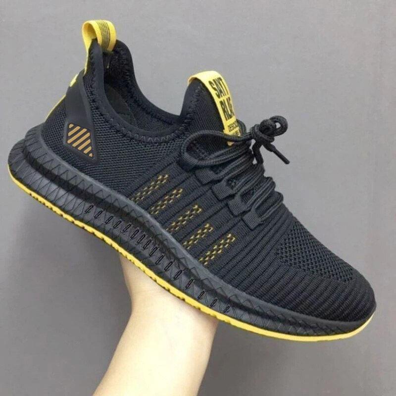 Black and yellow sneaker on a gray background