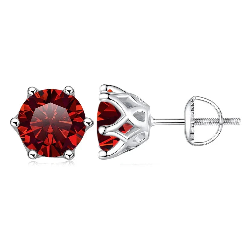 Pair of red gemstone stud earrings on a white background