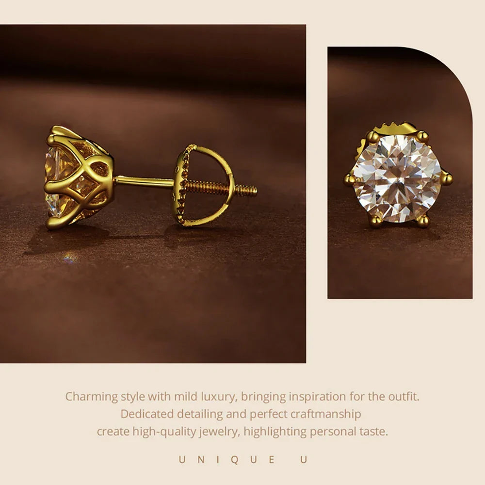 Gold earrings with clear gemstones on a brown background, featuring the brand 'UNIQUE U'.