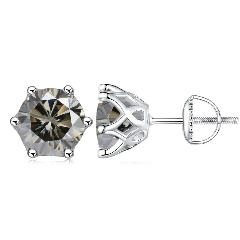A pair of silver stud earrings with round-cut clear gemstones, shown from the front and side on a white background.