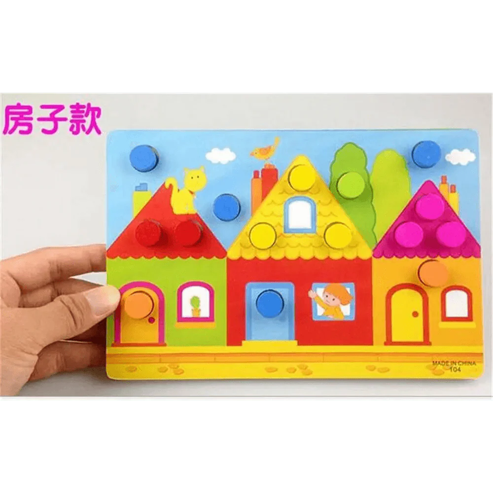 Colorful children's puzzle with house design held by a hand on a white background