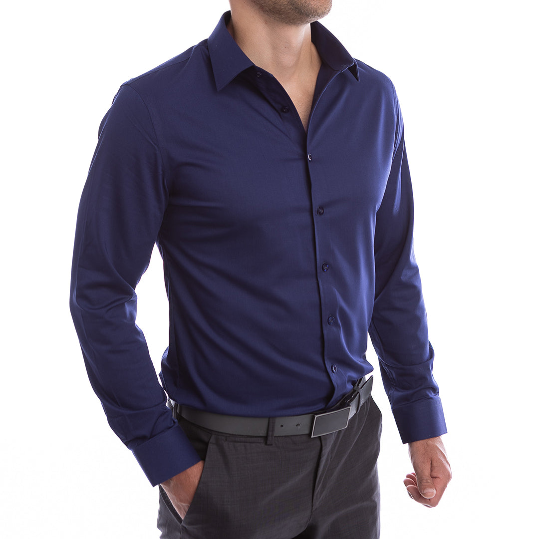 Man wearing a blue dress shirt and black pants on a white background
