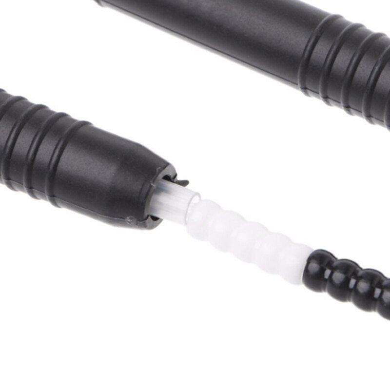 Close-up of a black and white jump rope on a white background