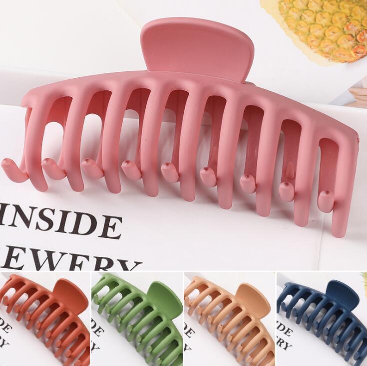Collage of pink hair clip with other color options on a white background