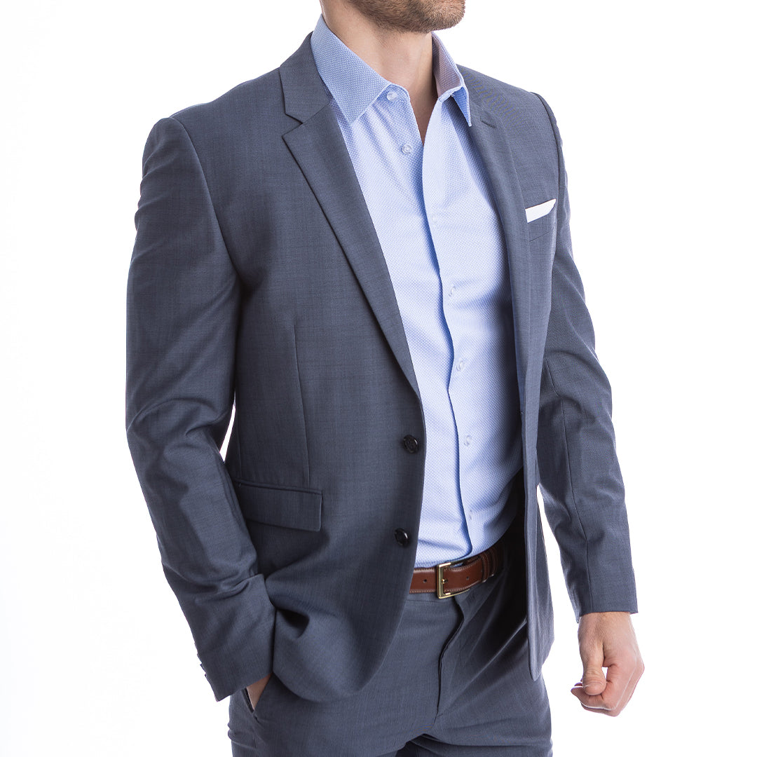 Gray suit jacket over a light blue shirt on a white background