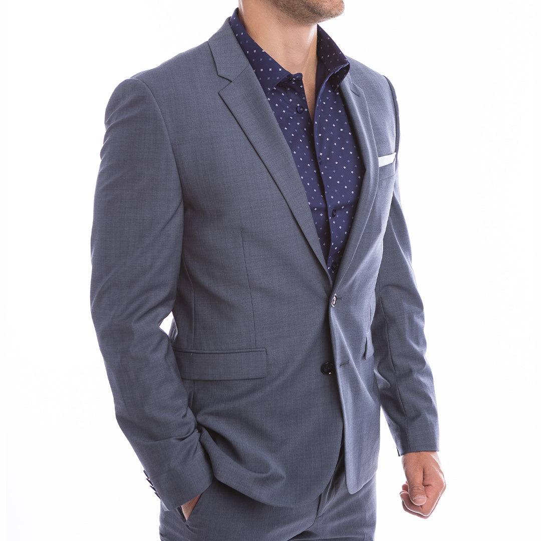 Gray suit jacket over a patterned shirt on a white background