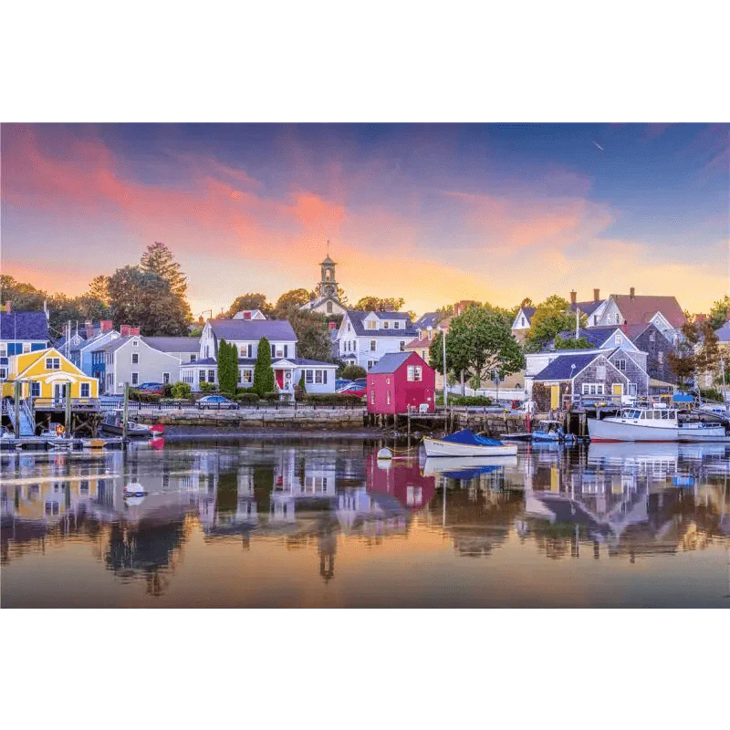 Harbor scene with colorful houses and boats at sunset