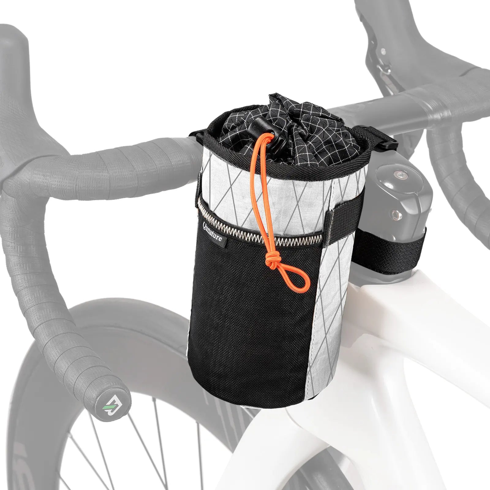 A bicycle handlebar bag mounted on a road bike's handlebar. The bag is black and white with a reflective diamond pattern, has an orange drawstring, and a black side strap.