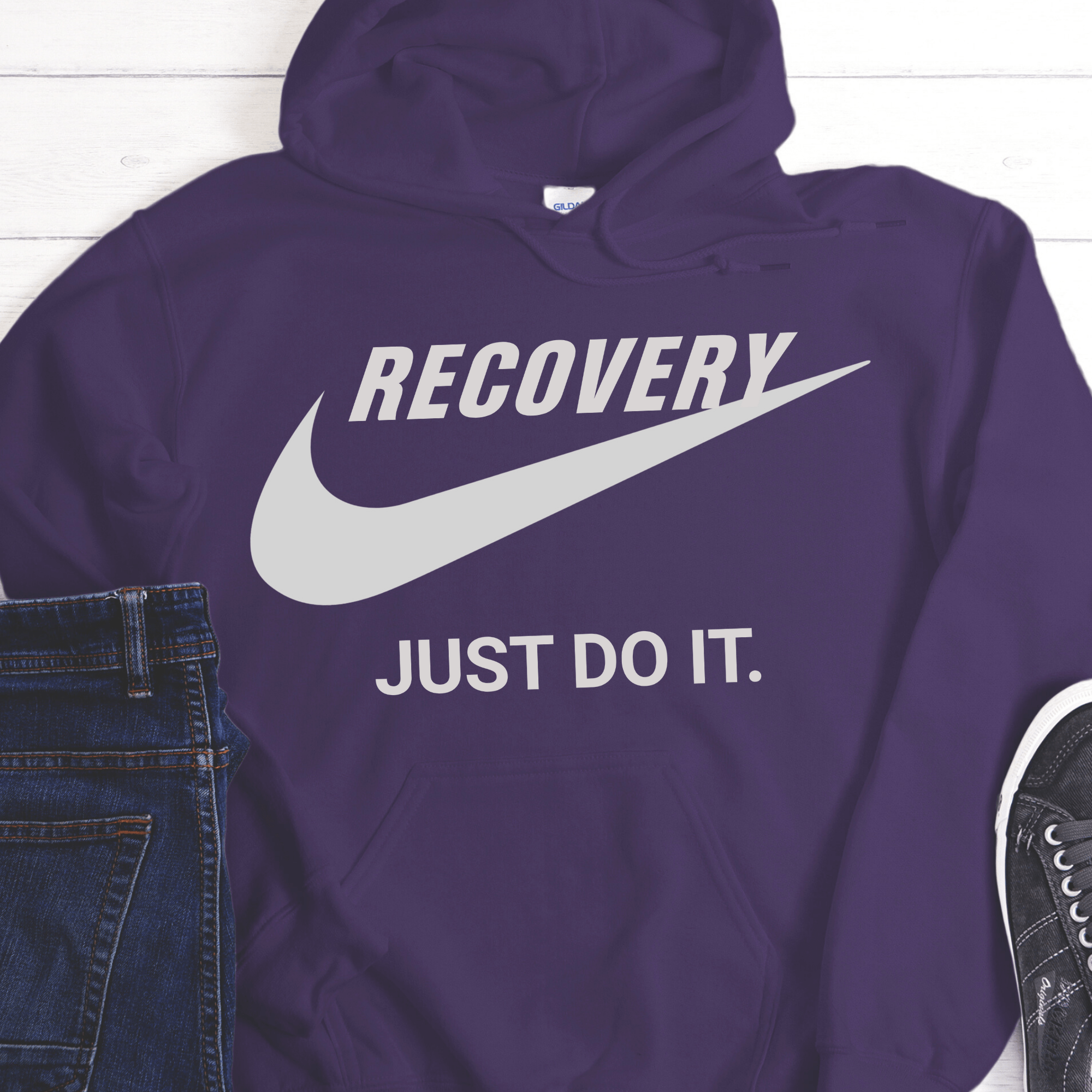 Purple hoodie with 'RECOVERY JUST DO IT.' text on a white background