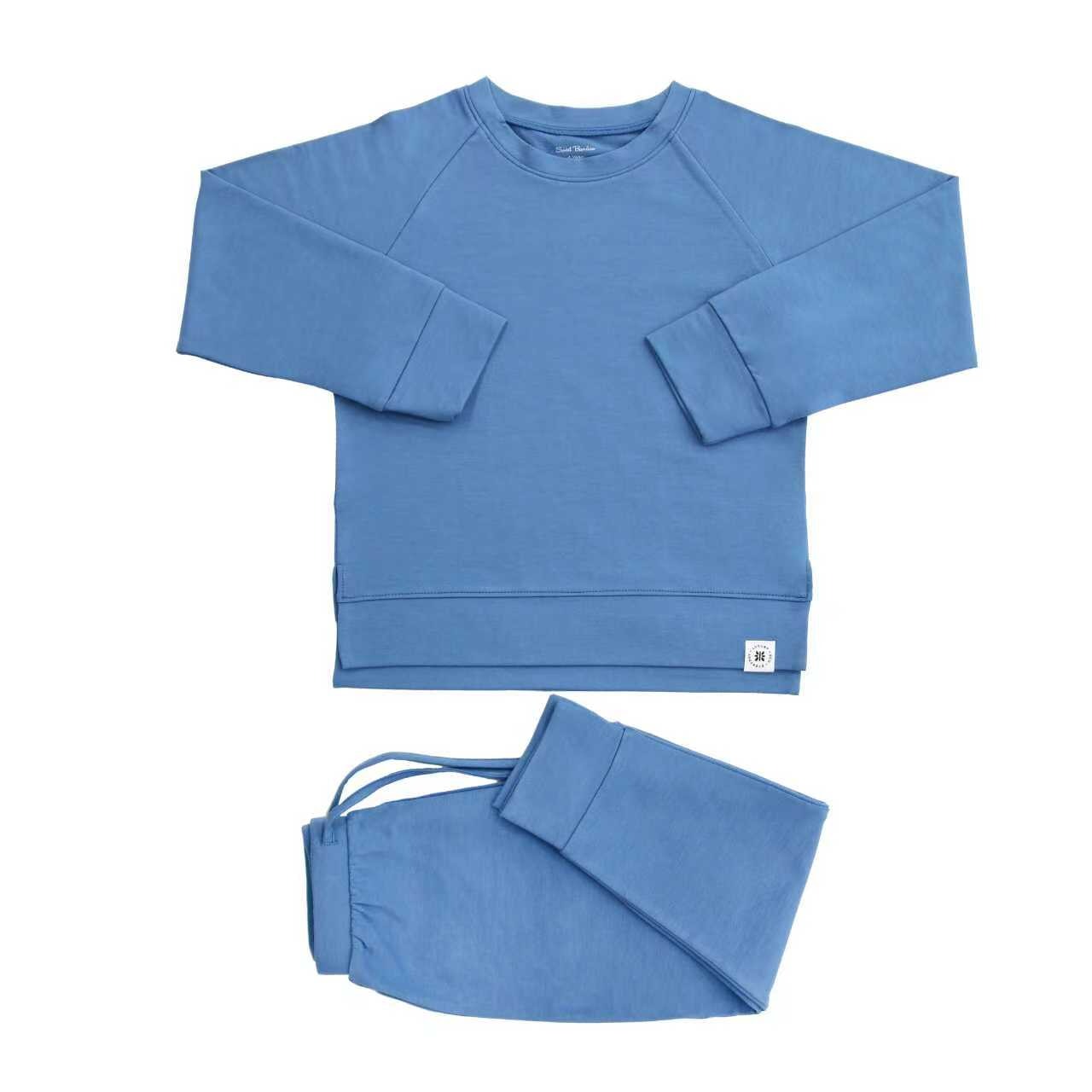 Blue sweatshirt and pants set on a white background