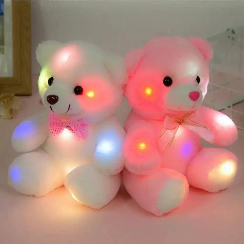 Two LED teddy bears, one white and one pink, on a light background.