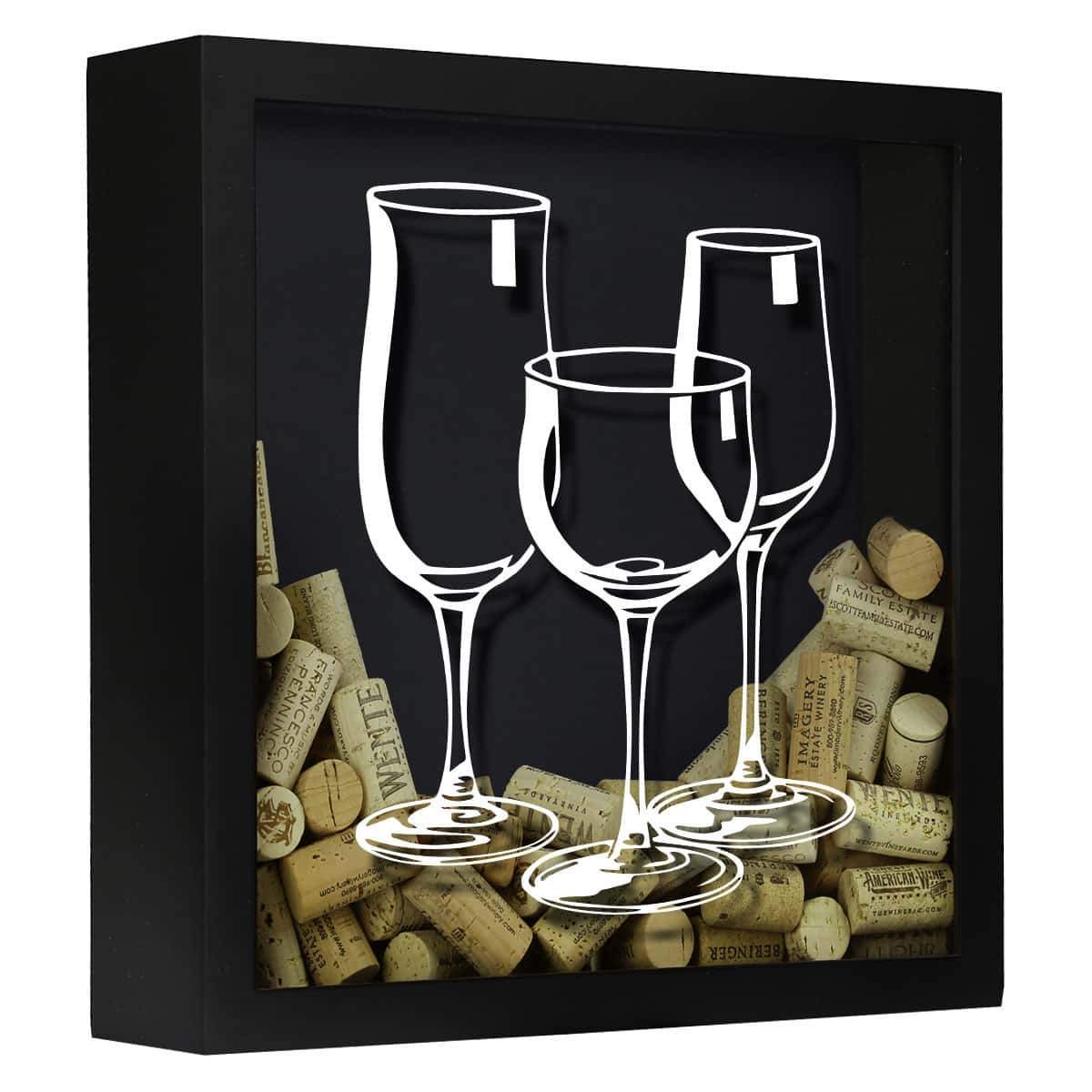 Decorative shadow box with wine glasses and corks on a black background