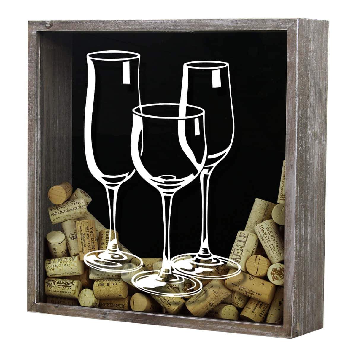 Decorative shadow box with wine glasses and corks on a black background