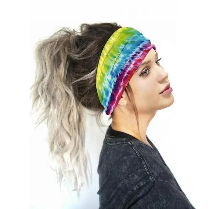 Woman wearing a colorful tie-dye headband on a white background
