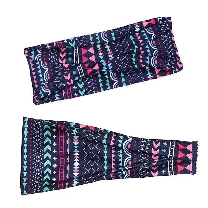 Two patterned arm sleeves with tribal design on a white background
